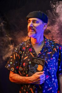 The author surrounded by mist, with his book